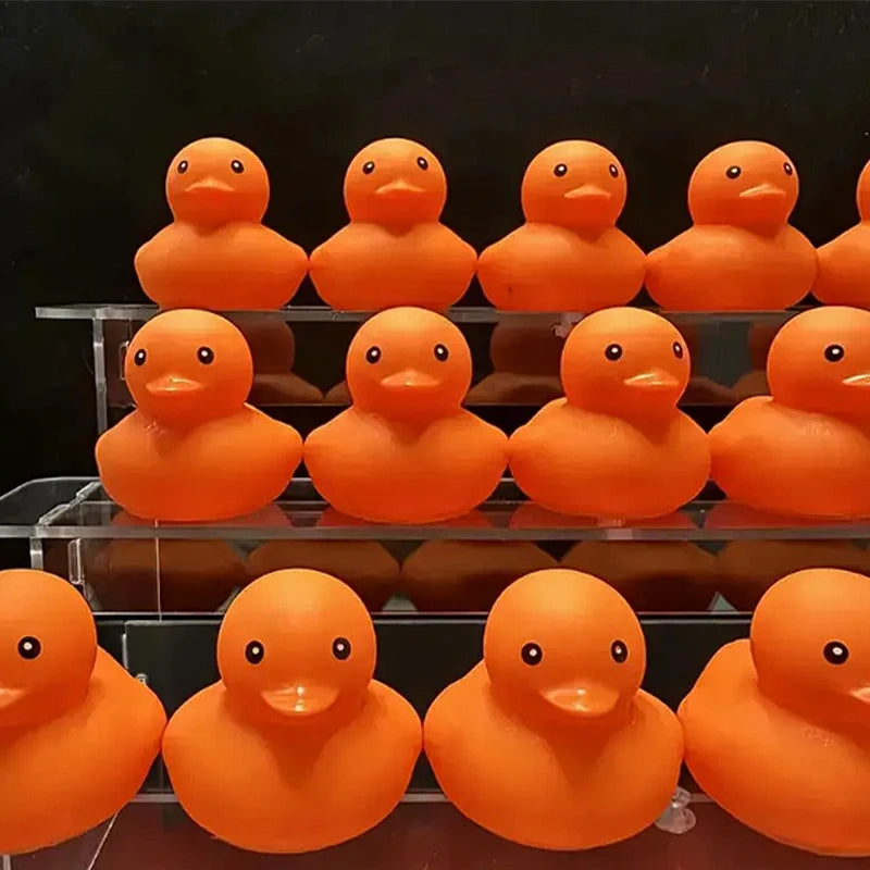 CowLost | product_id-1-100-pcs-orange-squeaky-rubber-ducks-for-party-favors-prizes-and-car-decor |6