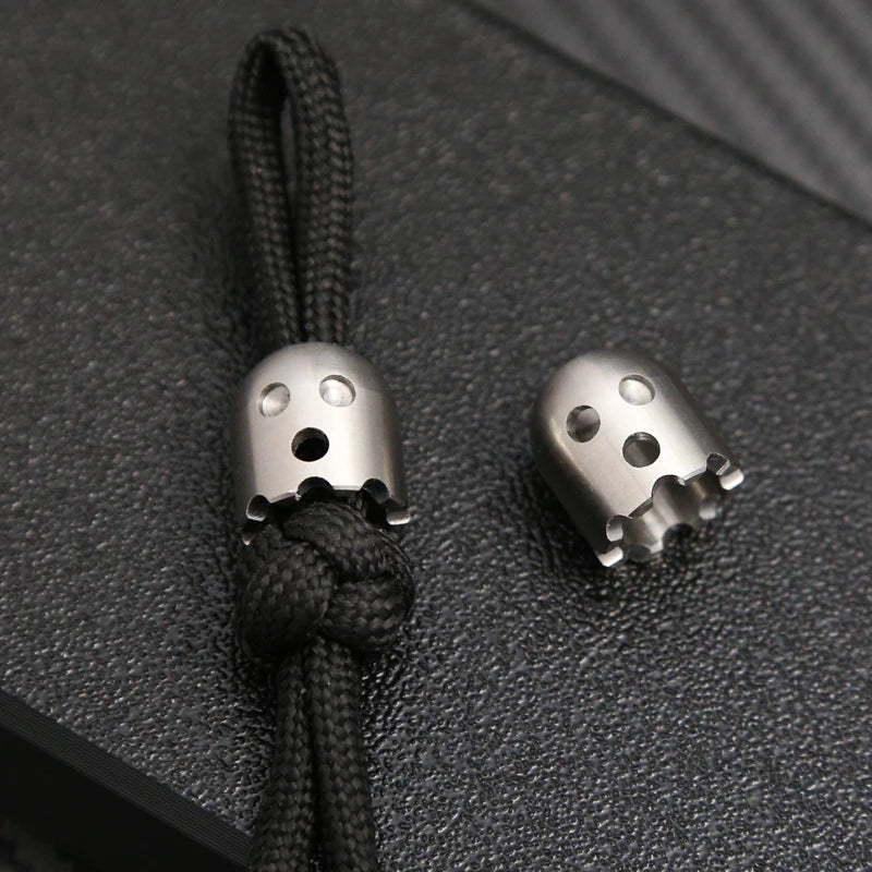 CowLost | product_id-ghost-shaped-stainless-steel-pendant-with-paracord-rope-stress-reliever-edc-toy |5