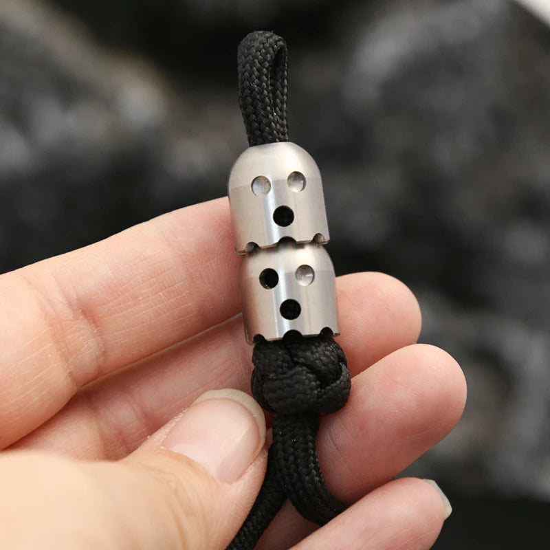 CowLost | product_id-ghost-shaped-stainless-steel-pendant-with-paracord-rope-stress-reliever-edc-toy |4