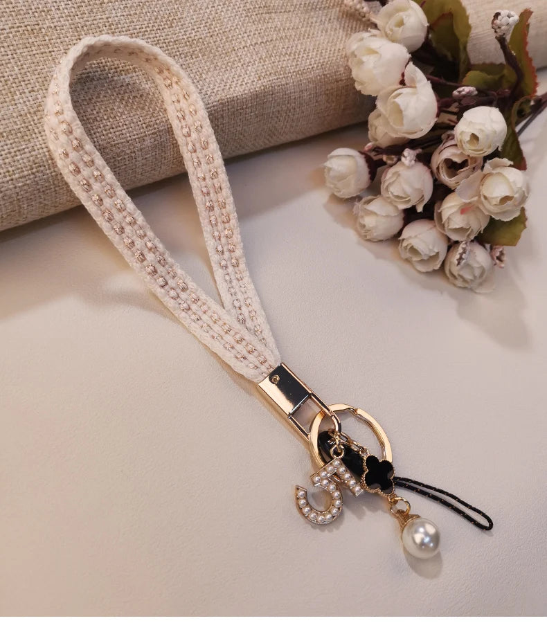 CowLost | activewear-pants-womens-short-phone-lanyard-with-woven-pearl-pendant-bracelet |20