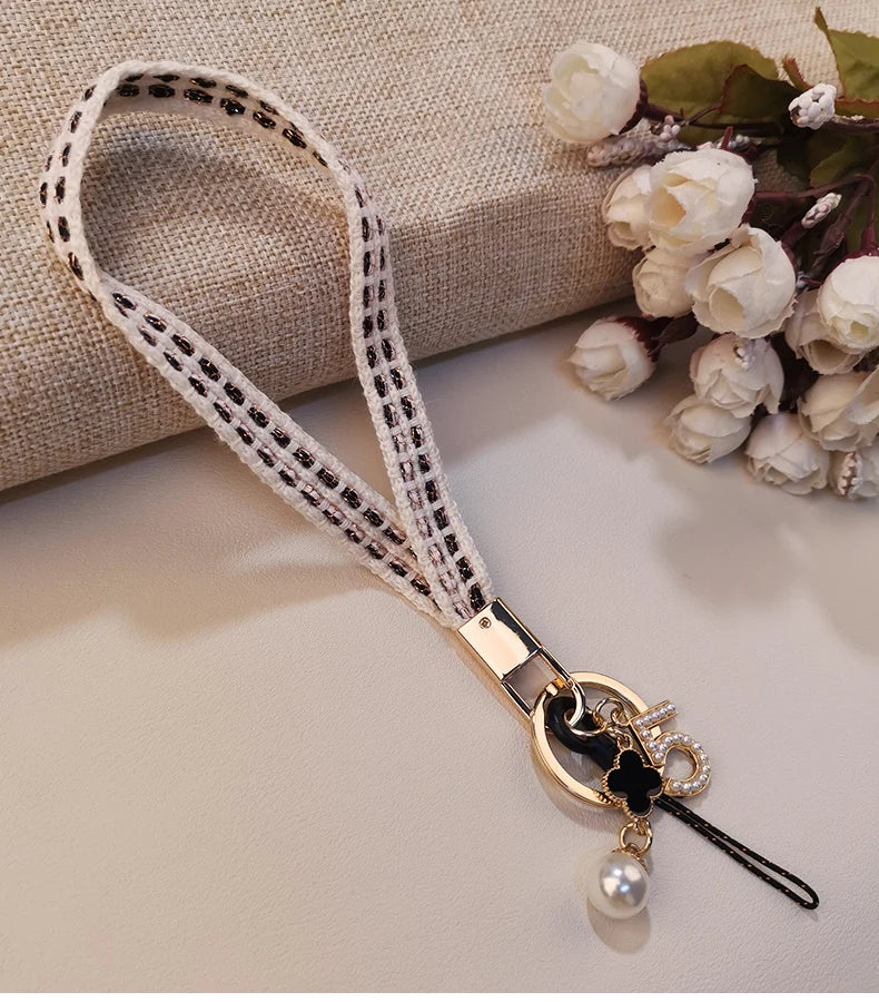 CowLost | activewear-pants-womens-short-phone-lanyard-with-woven-pearl-pendant-bracelet |17