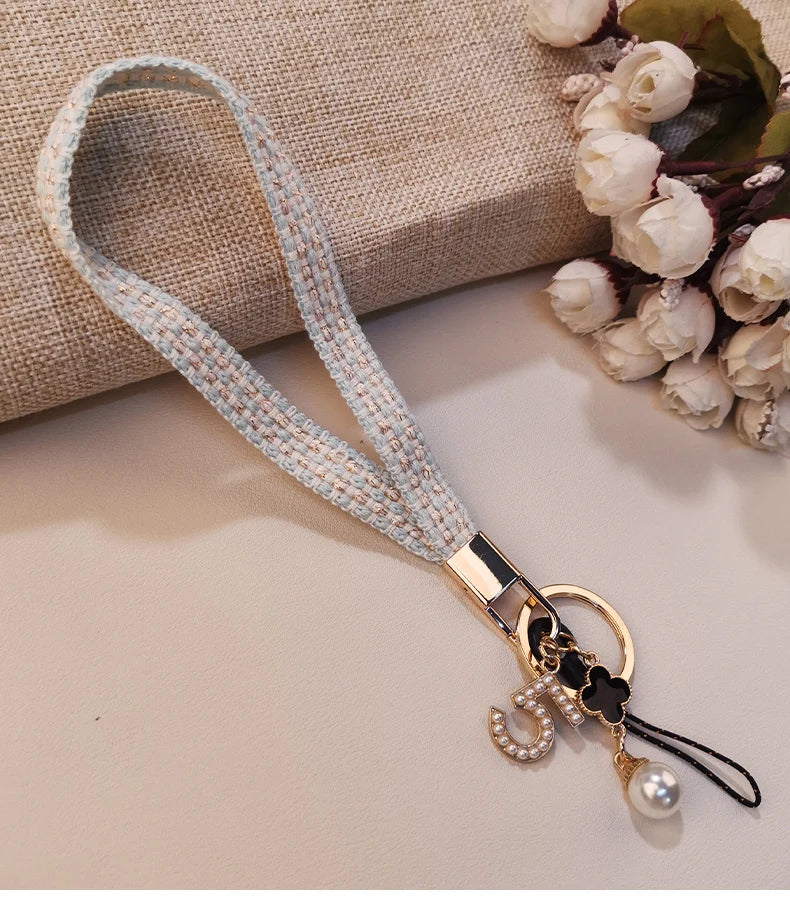 CowLost | activewear-pants-womens-short-phone-lanyard-with-woven-pearl-pendant-bracelet |18