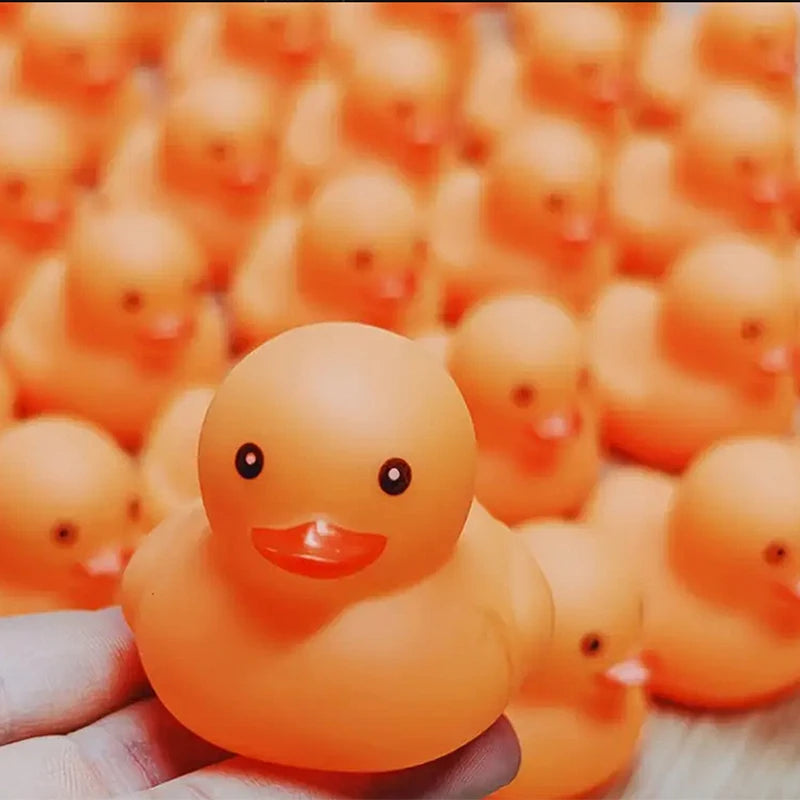 CowLost | product_id-1-100-pcs-orange-squeaky-rubber-ducks-for-party-favors-prizes-and-car-decor |2