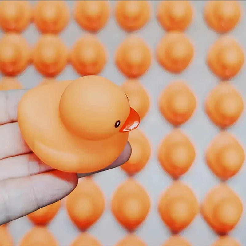 CowLost | product_id-1-100-pcs-orange-squeaky-rubber-ducks-for-party-favors-prizes-and-car-decor |3