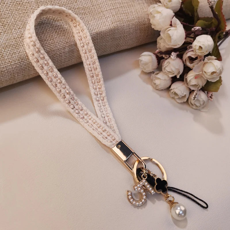 CowLost | activewear-pants-womens-short-phone-lanyard-with-woven-pearl-pendant-bracelet |23