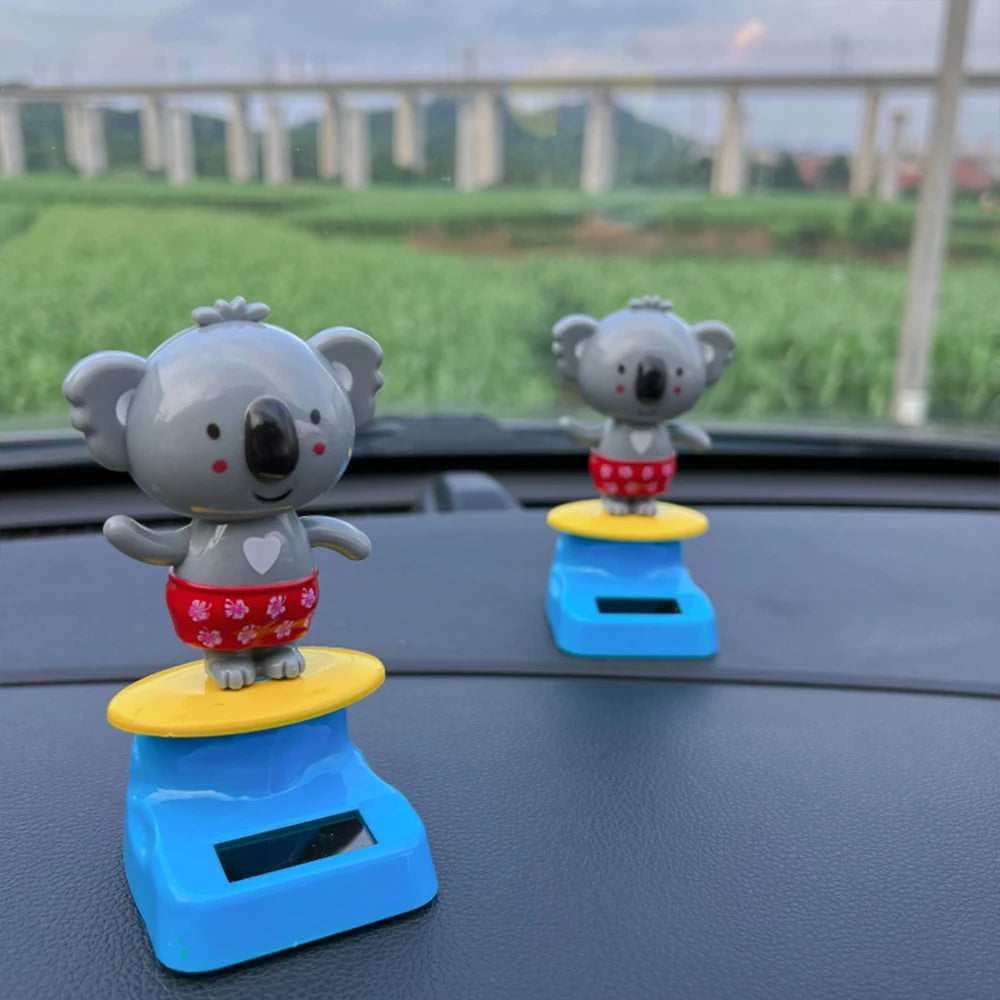 CowLost | cartoon-car-ornament-animal-kala-design-with-nodding-head-a-fun-decorative-piece-for-your-car-and-home |1