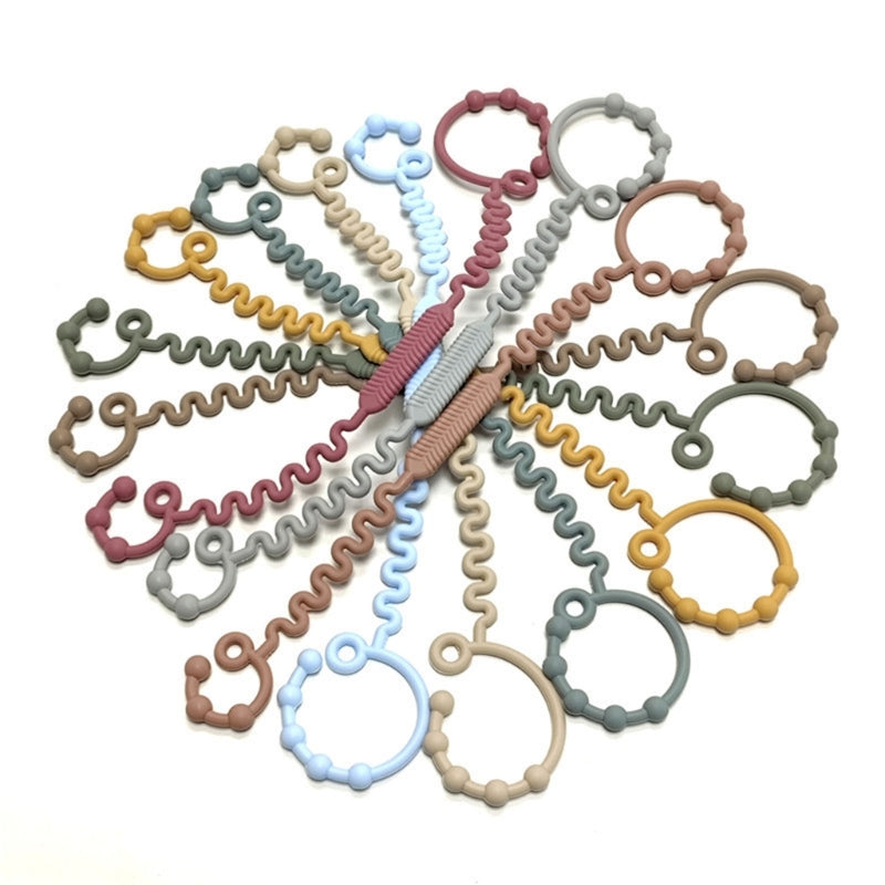 CowLost | versatile-teething-toy-bottle-holder-silicone-strap-practical-reliable-teether |10